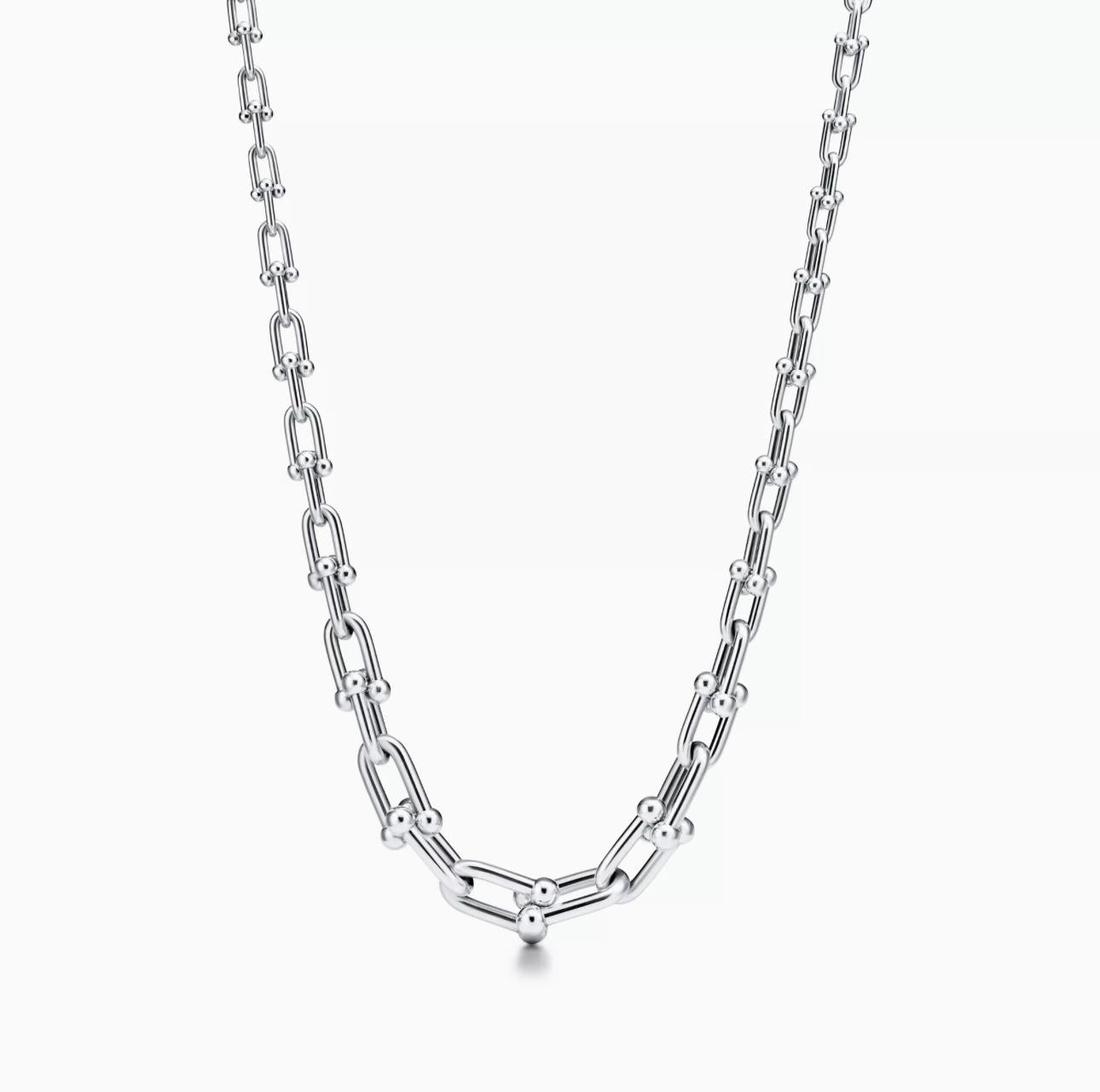Silver chain necklace on a white background