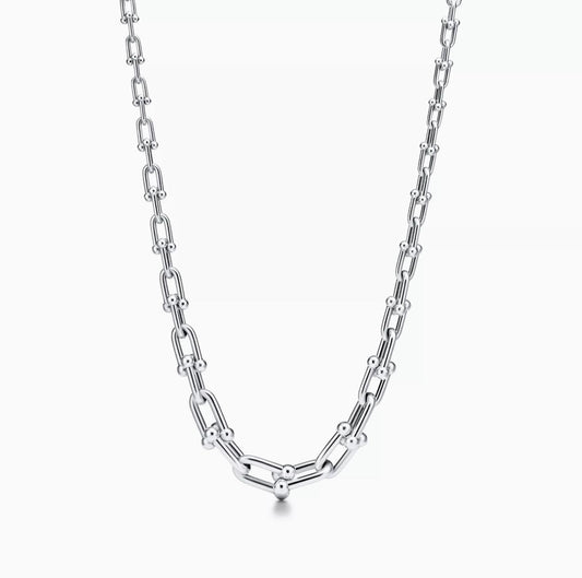 Silver chain necklace on a white background
