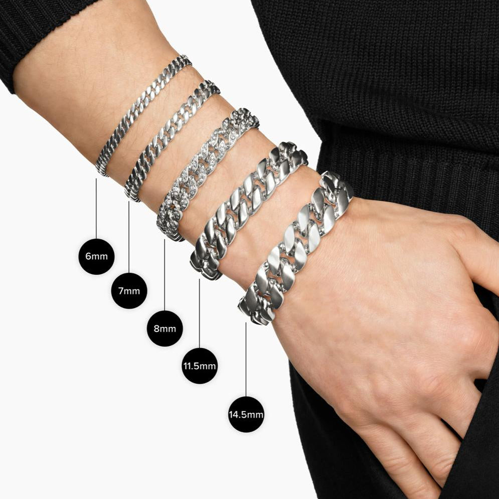 Silver bracelets on a wrist with size labels against a white background