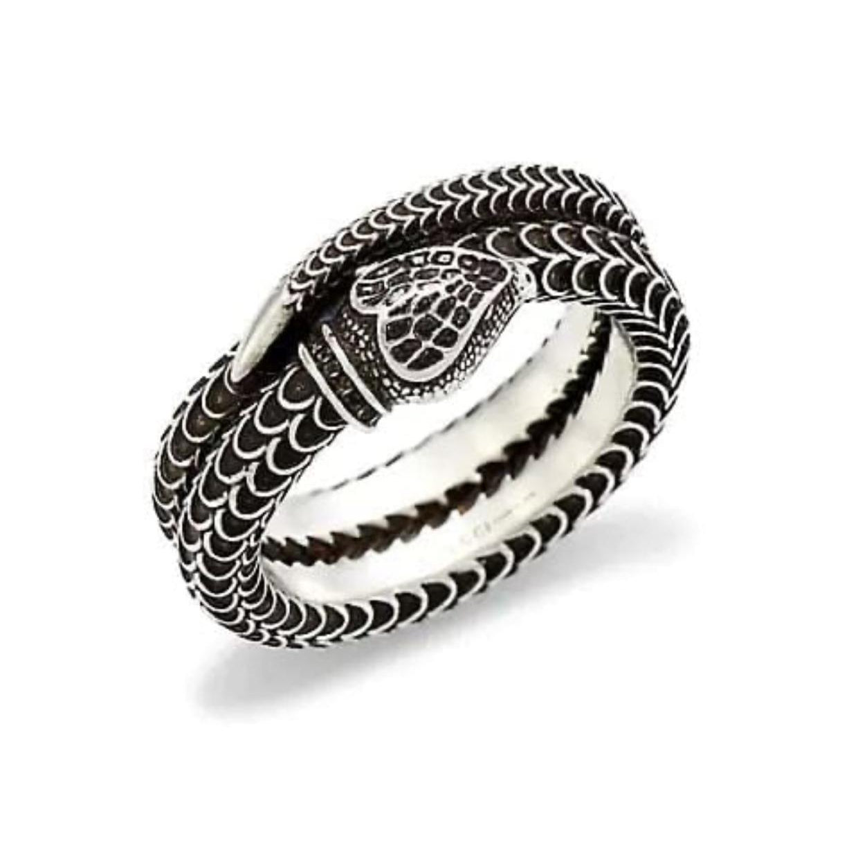 Silver snake-shaped ring on a white background