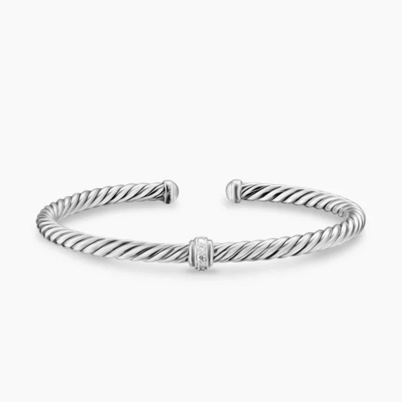 Sterling silver twisted cable cuff bracelet with a central pavé-accented ring.